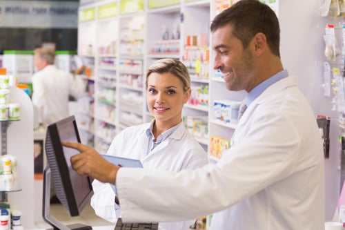 Team of pharmacists using computer at the hospital pharmacy